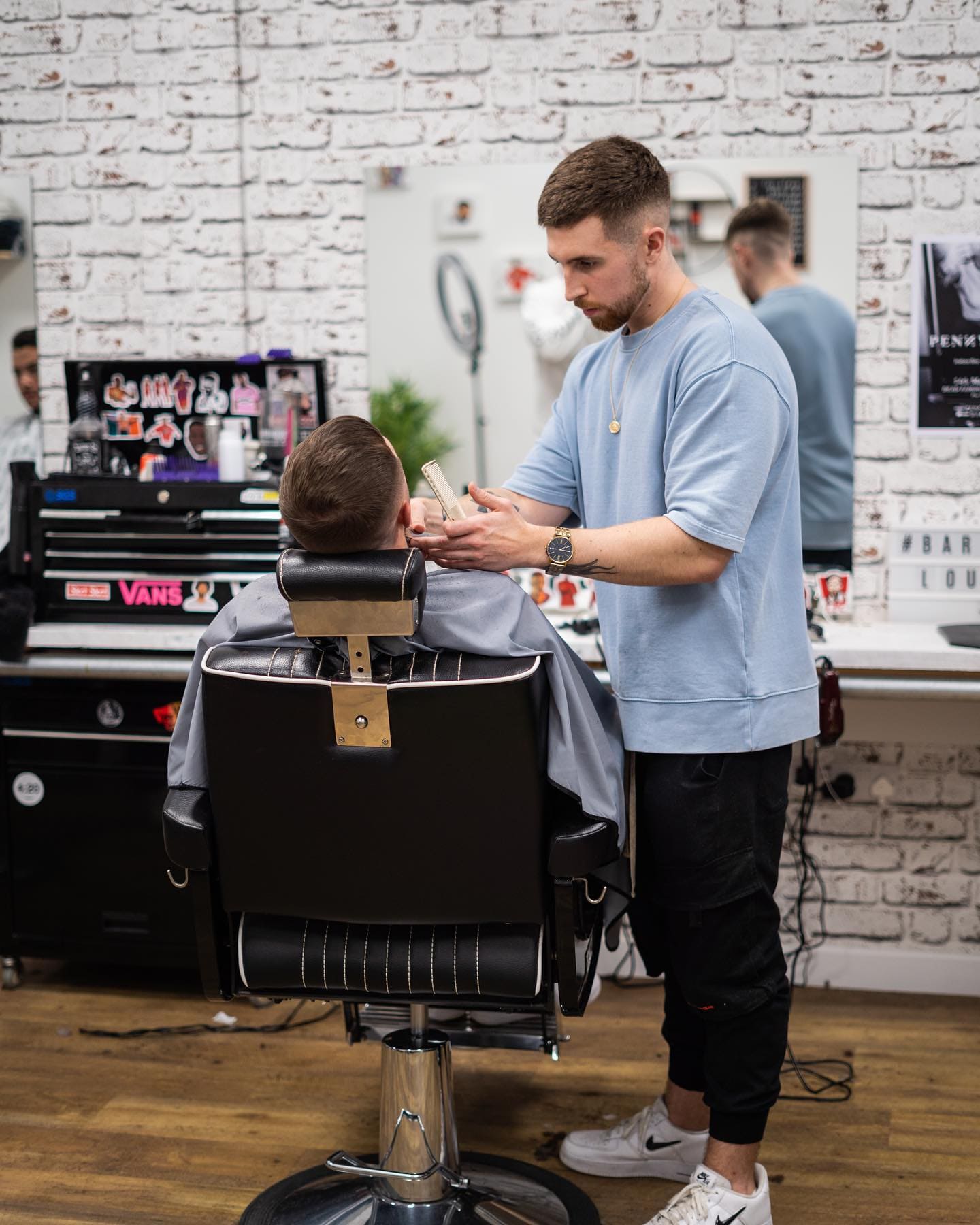 Barber Cutting His Clients Hair