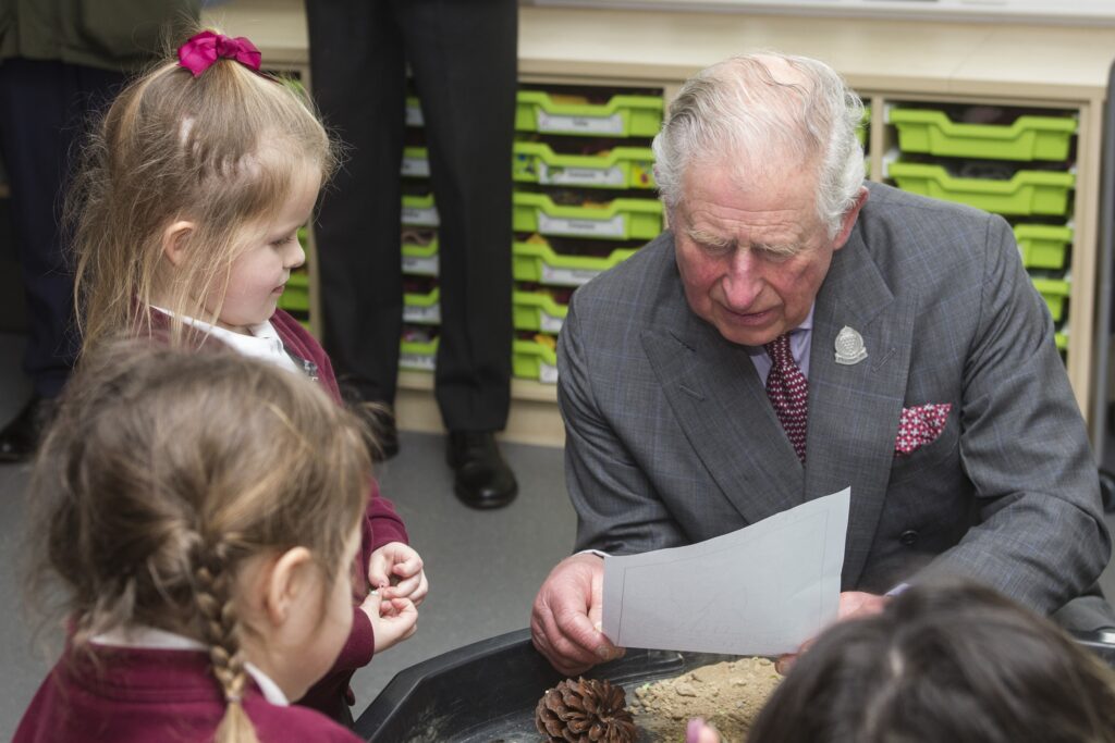 HRH The Duke of Cornwall with children at Nansledan's primary school during a visit in March 2020. The school has won a social impact award.