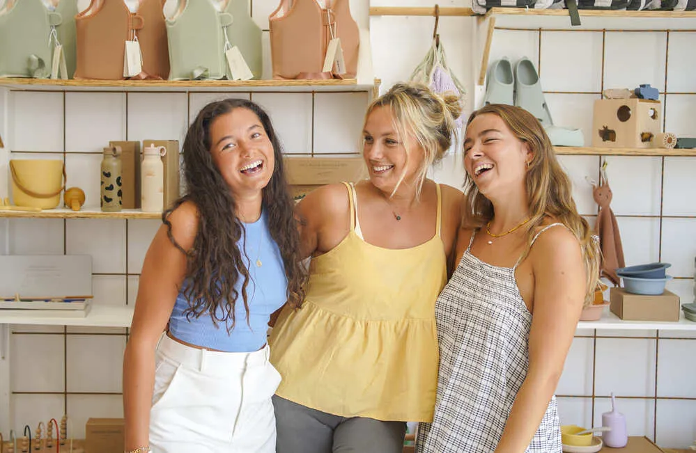 three girls in teylu store laughing and smiling 1 2