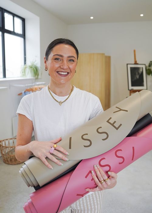 Issey Standing with Yoga Mats