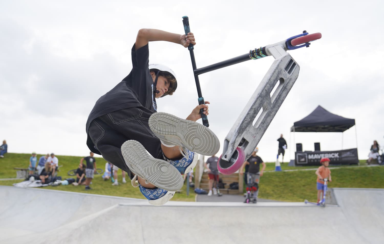 Boy doing trick on scooter