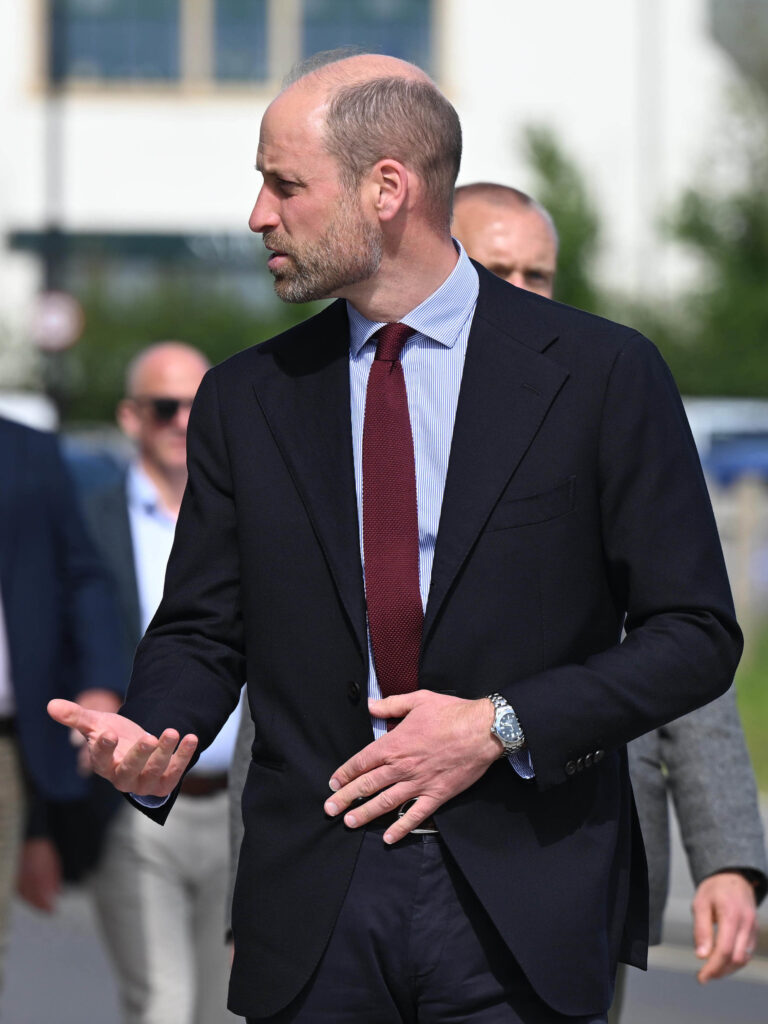 Duke Of Cornwall Man In A Suit And Tie Talking To A Group Of People